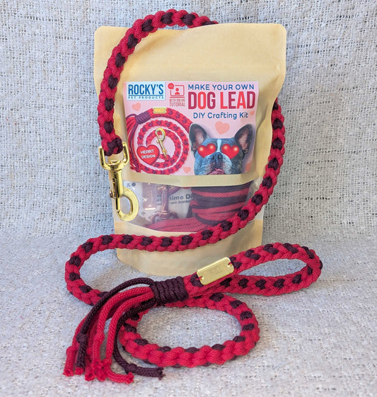 Red and cherry braided dog leash with gold clasp on a Rocky's DIY crafting kit packaging.